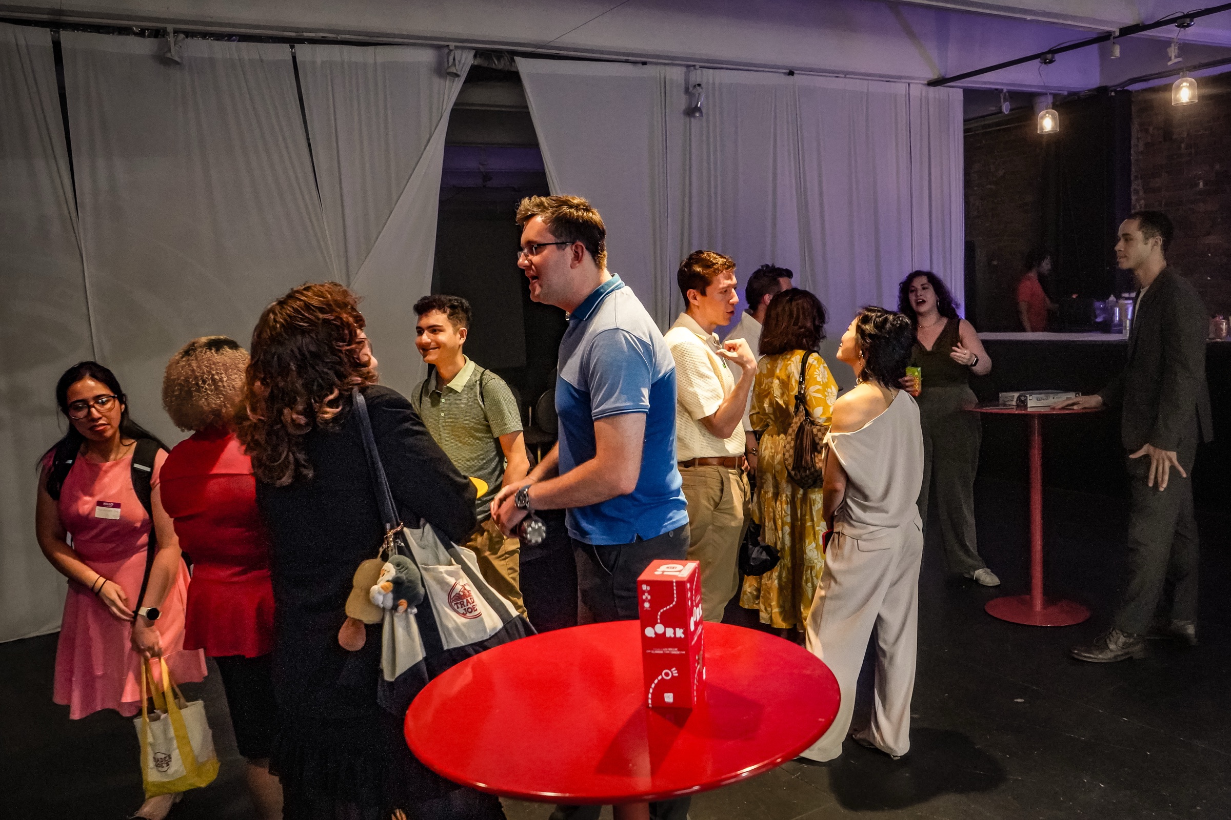 Guests talking and connecting at an Out of Office gathering