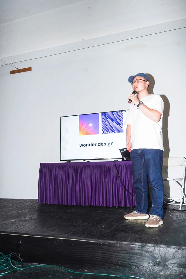 A speaker presents on stage at Future of NYC Design.