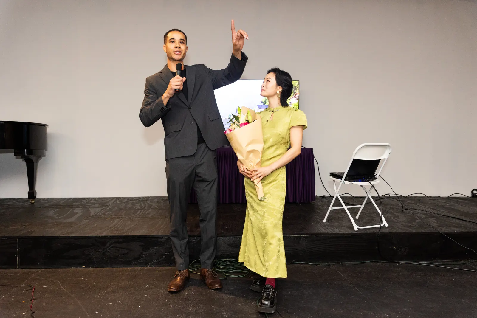 Two hosts share the stage during the Future of NYC Design program.