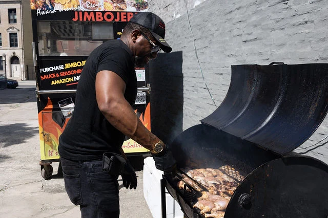 A food vendor prepares a dish during High Society.