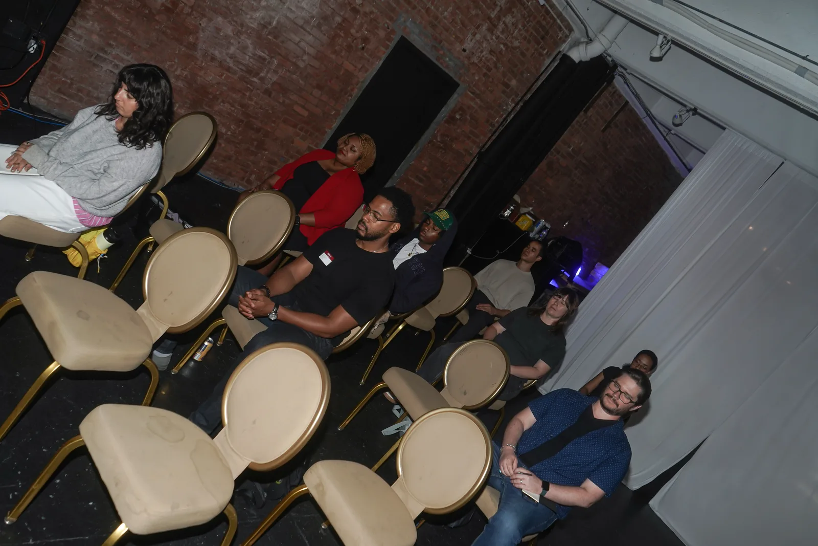 An overhead view of guests seated for an Out of Office program.