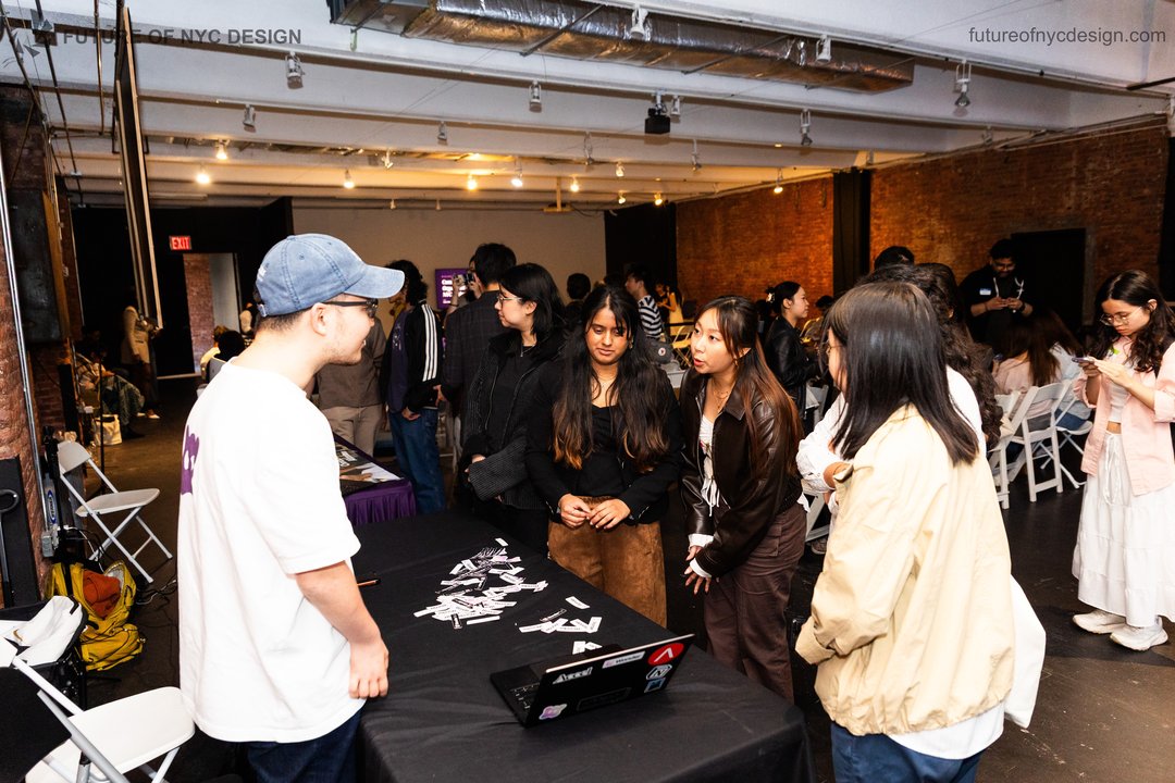Guests speaking with a sponsor at the Future of NYC Design gathering